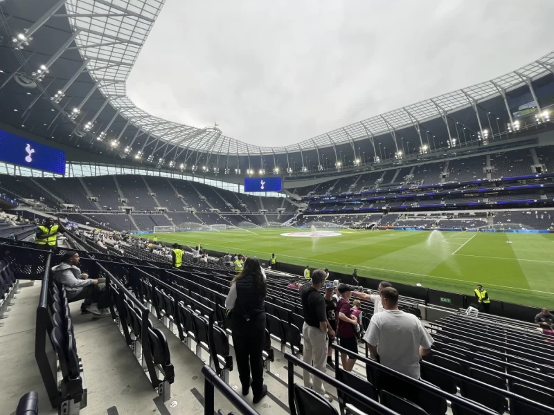 The pitch being watered in a fairly empty Tottenham Hotspur Stadium ahead of the opening fixture of the 2025-6 Premier League season