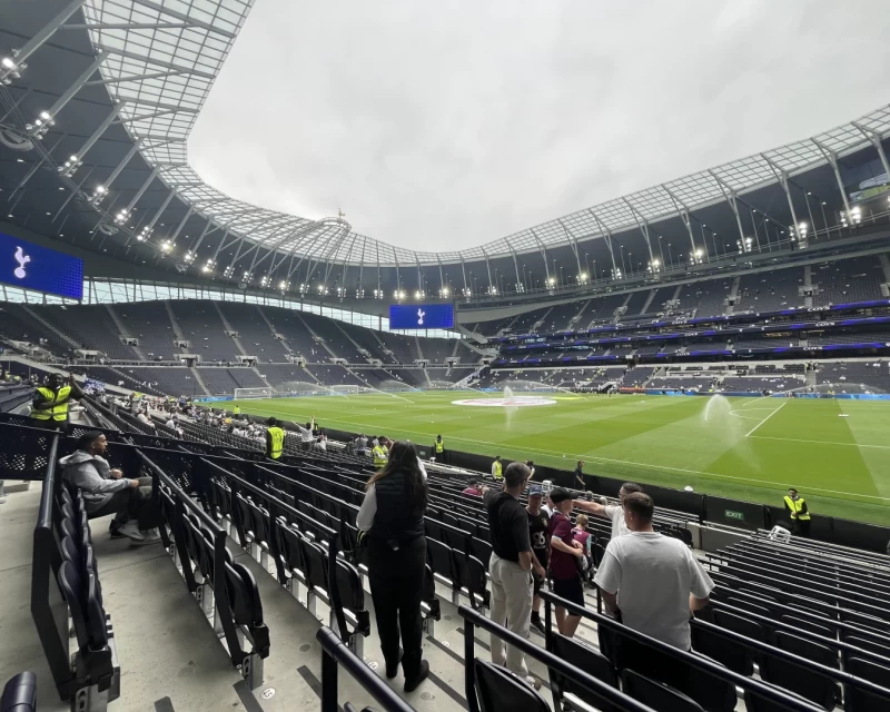 The pitch being watered in a fairly empty Tottenham Hotspur Stadium ahead of the opening fixture of the 2025-6 Premier League season
