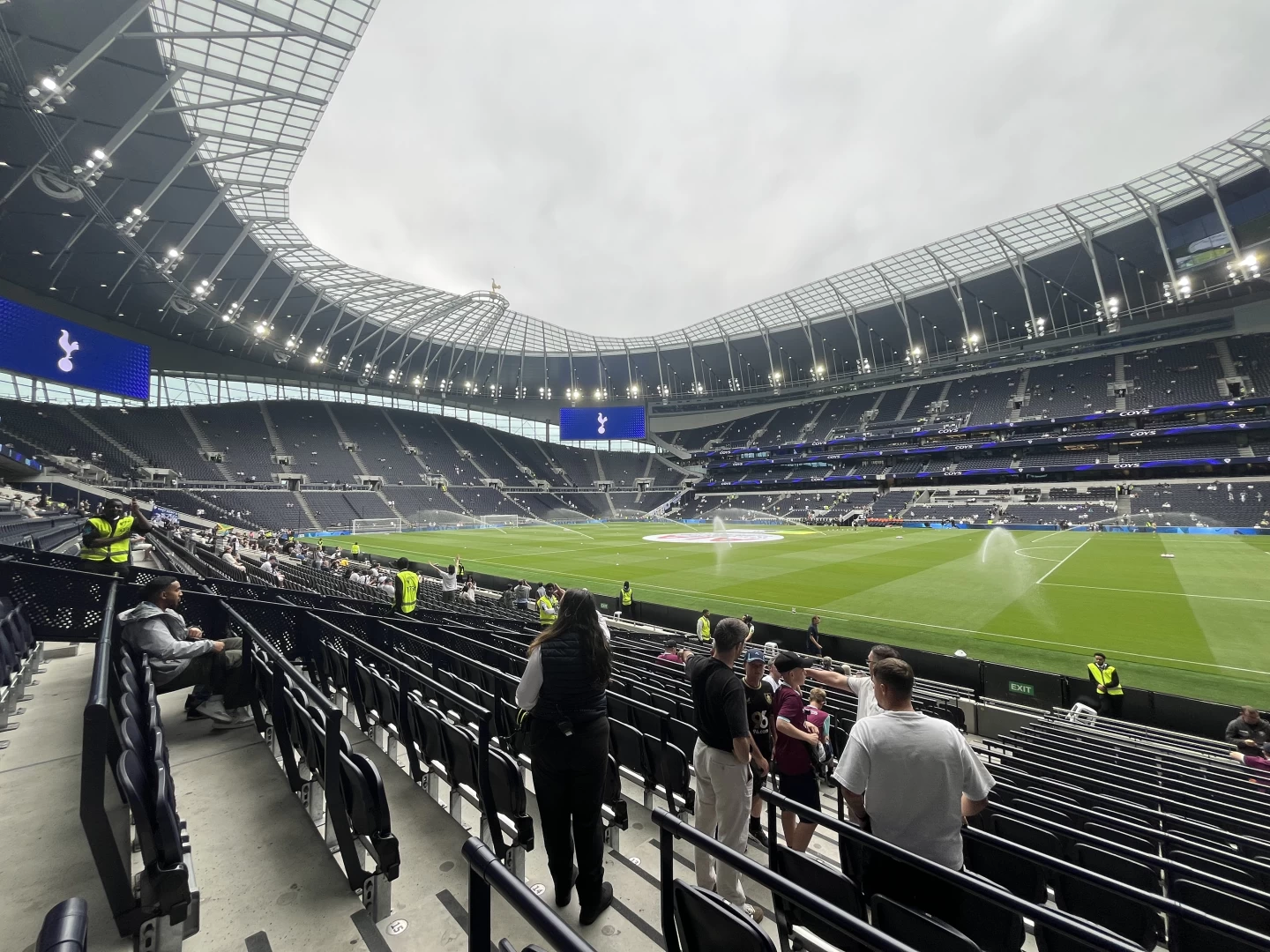 The pitch being watered in a fairly empty Tottenham Hotspur Stadium ahead of the opening fixture of the 2025-6 Premier League season