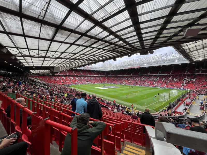 Picture looking diagonally across the pitch at Old Trafford as the stadium begins to fill ahead of kick off