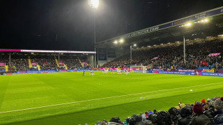 Burnley take a free kick against Middlesbrough under the lights at Turf Moor, as Storm Darragh approaches.