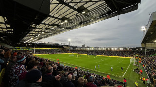 View diagonally across the pitch at Carrow Road from the away section in the South Stand as Norwich City prepare to take on Burnley.  The bloody drummer is in shot immediately behind the goals to the right of the picture.