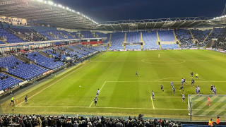 Burnley take a corner in their 3rd round FA cup tie with Reading on 11 Jan 2025, late in the game with dark skiy, and floodlights on.