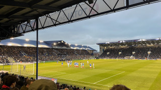 Burnley prepare to take a free-kick, late in the second half against Portsmouth at Fratton Park